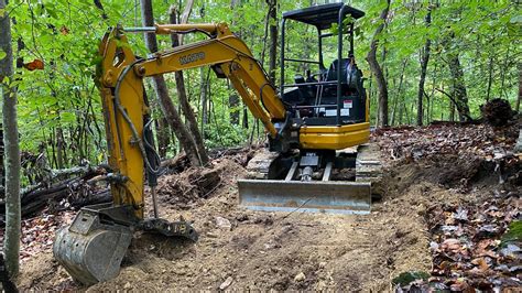 building trailes with a mini excavator|trail building mini ex.